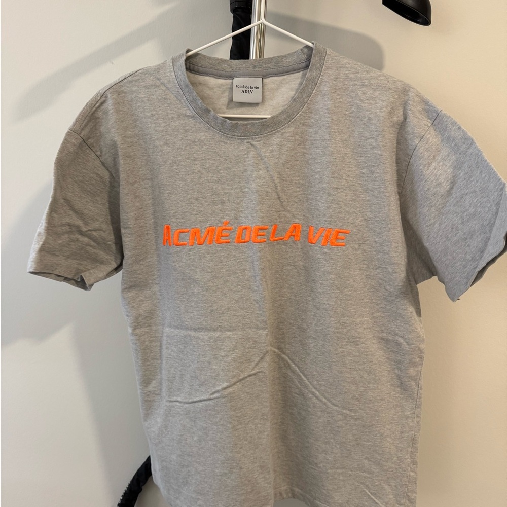 ACME DE LA VIE Gray T-Shirt with Orange Logo